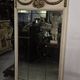 Louis XVI style trumeau mirror with a painted wooden frame.