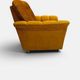 Vintage lounge chair on wheels in golden mustard corduroy 70s
