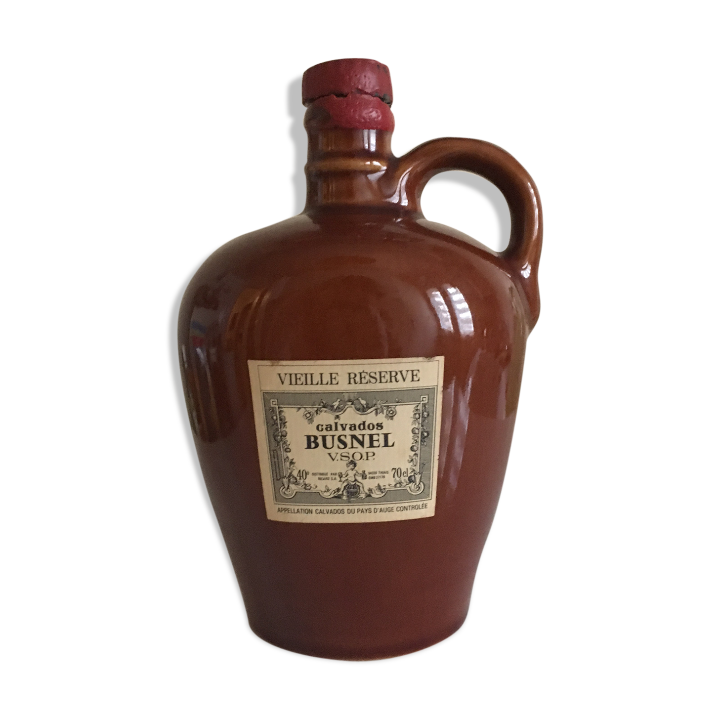 Old bottle of Calvados in sandstone