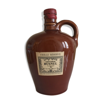Old bottle of Calvados in sandstone