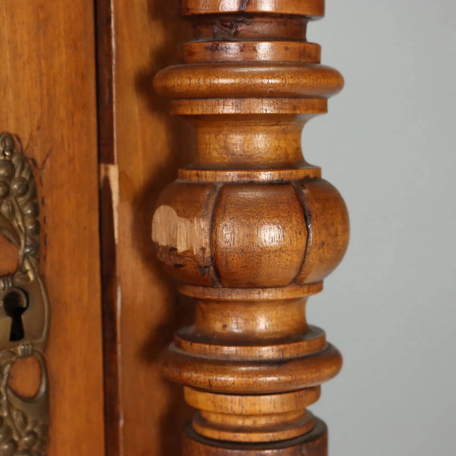 Antique walnut wardrobe with glass and carvings, Italy, 19th century.