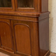 English showcase in two mahogany bodies and 19th century veneer