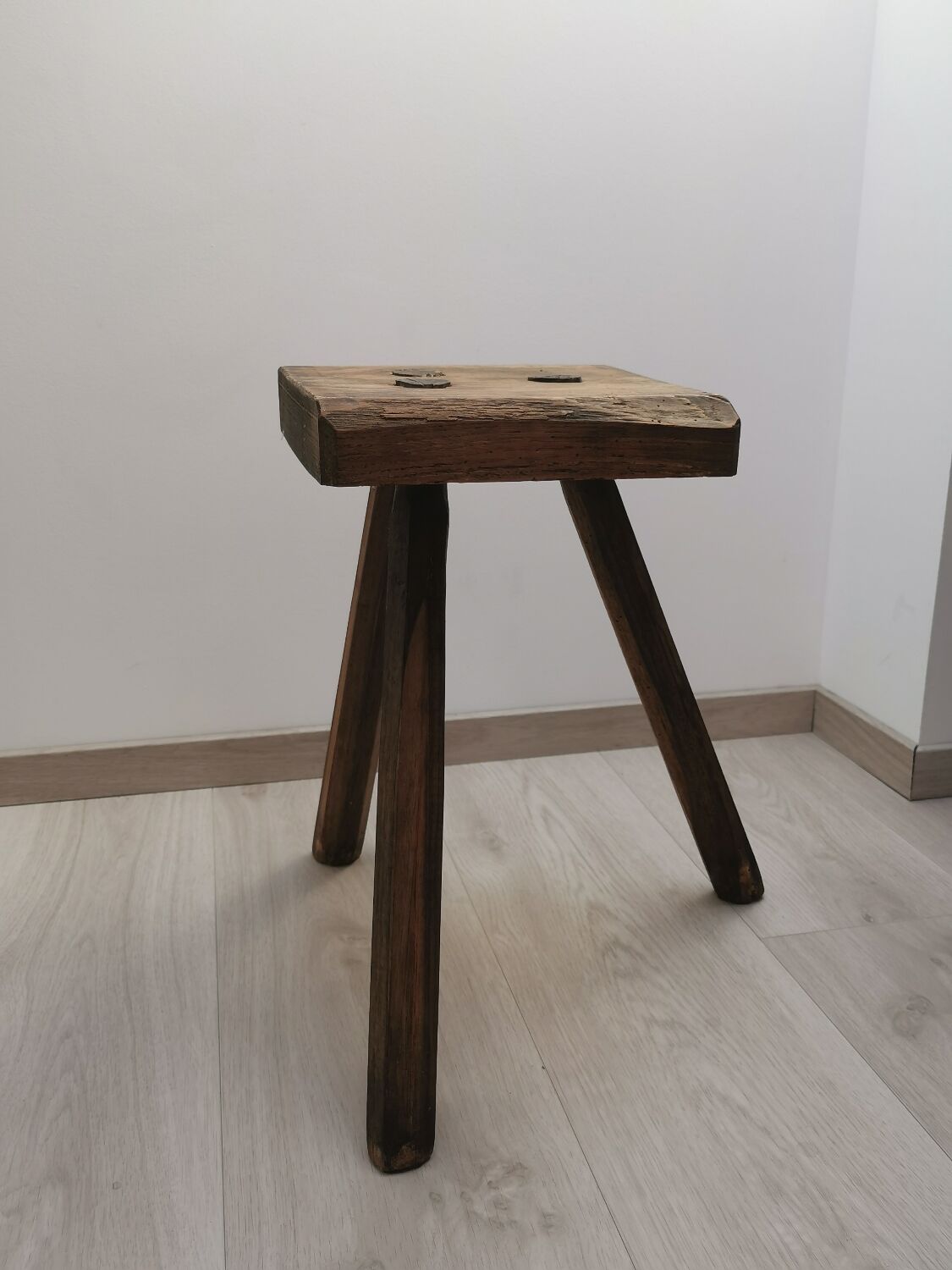 Old wooden stool tripods