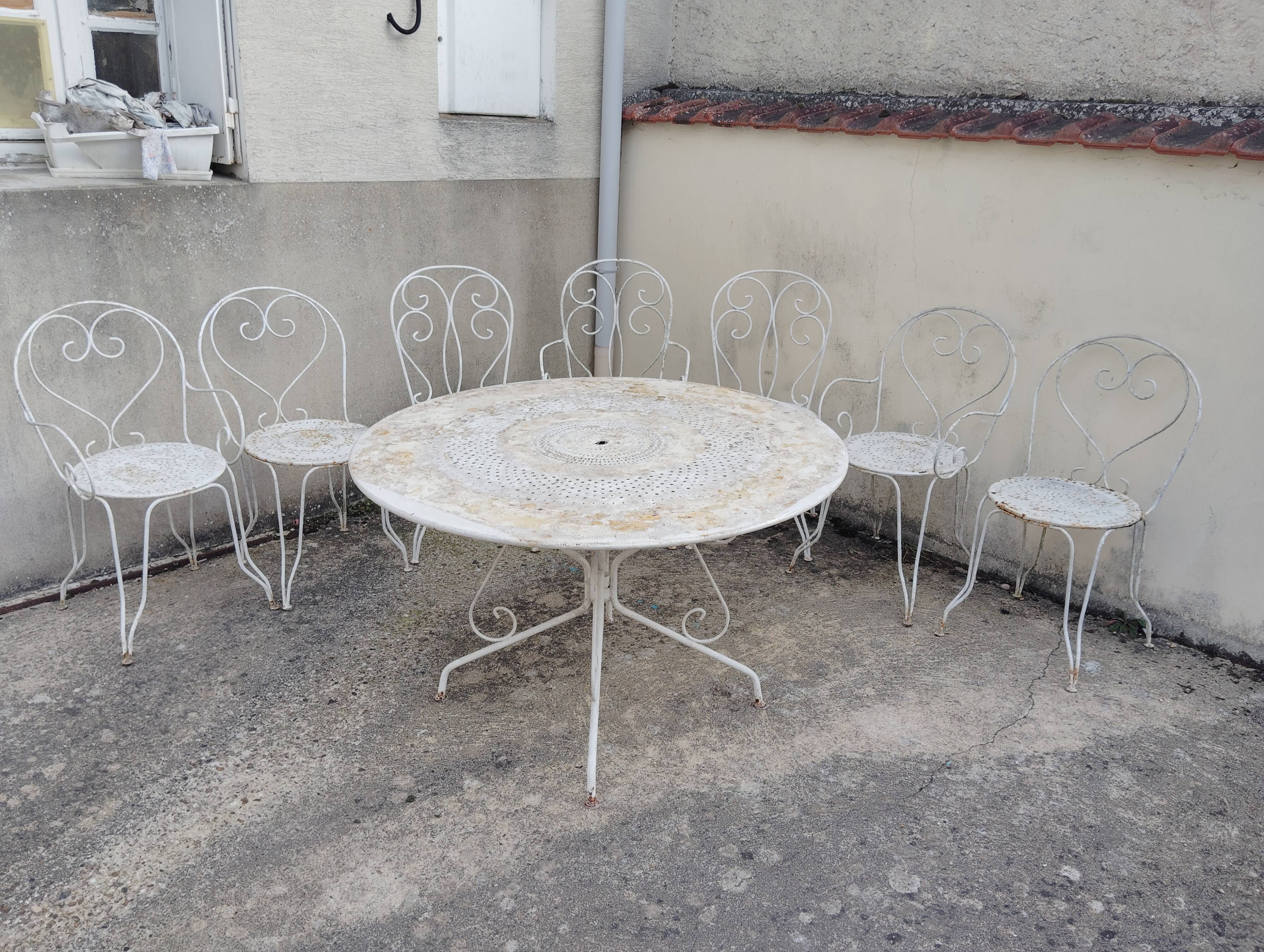 Wrought iron garden furniture from the early 20th century.