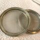Pair of silver metal and glass bottle bottoms