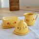 Vintage yellow ceramic milk jug – Hand-painted floral pattern