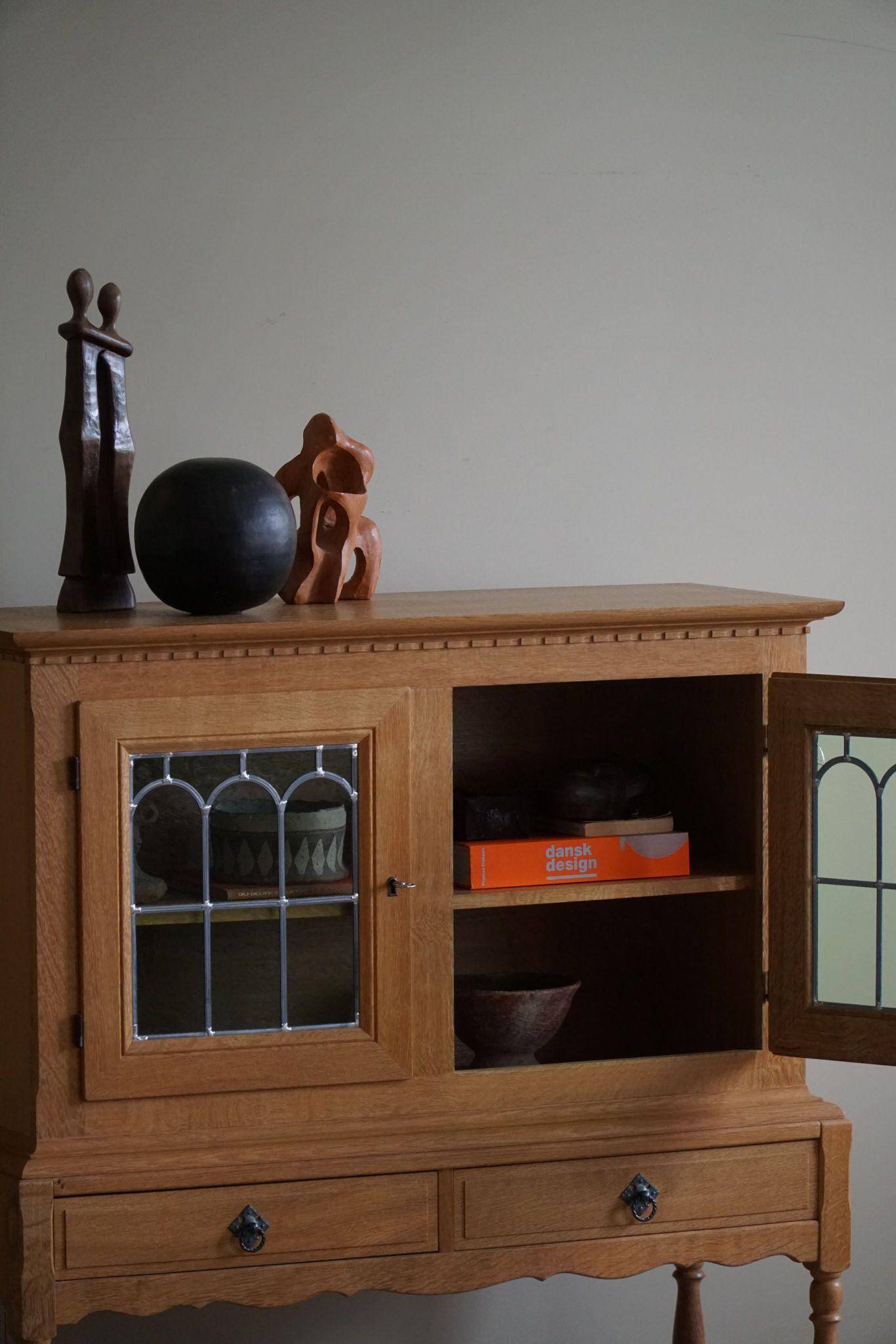 20th-century solid oak display cabinet with a glass front, by a Danish cabinetmaker.
