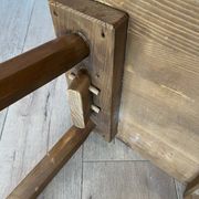 Pair of vintage wooden chairs in alpine chalet style.