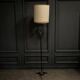 1960 floor lamp on gold metal winged base with black barrel