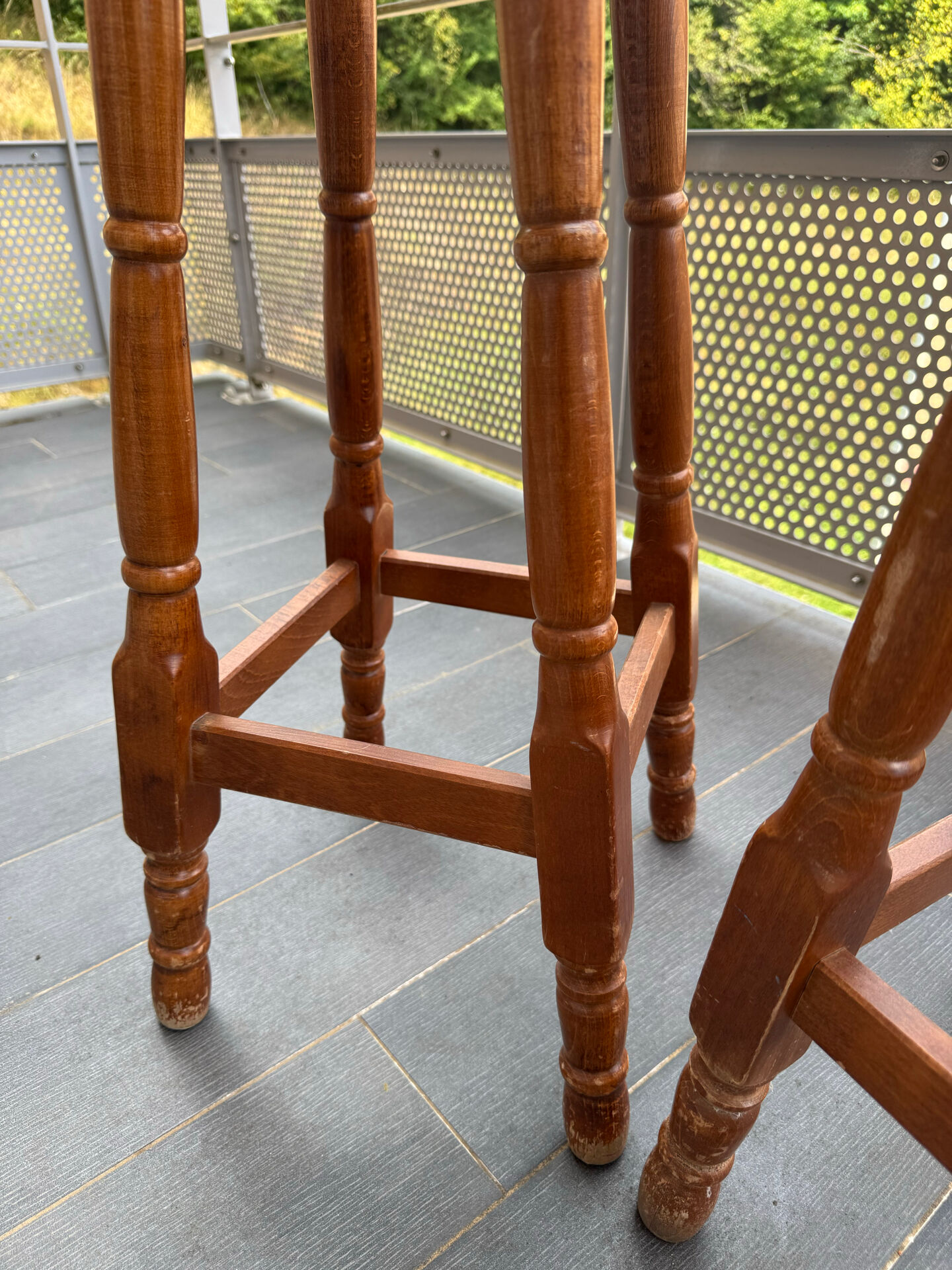 pair of vintage wooden and leather bar stools
