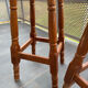 pair of vintage wooden and leather bar stools