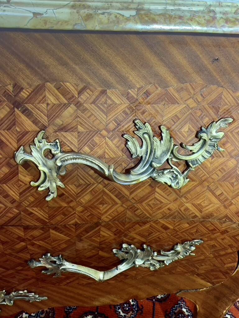 Louis XV chest of drawers, cubed rosewood marquetry, gilded bronzes, veined marble.