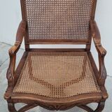 Louis XV Regency cane armchair leather armrests decorated with shell
