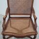 Louis XV Regency cane armchair leather armrests decorated with shell