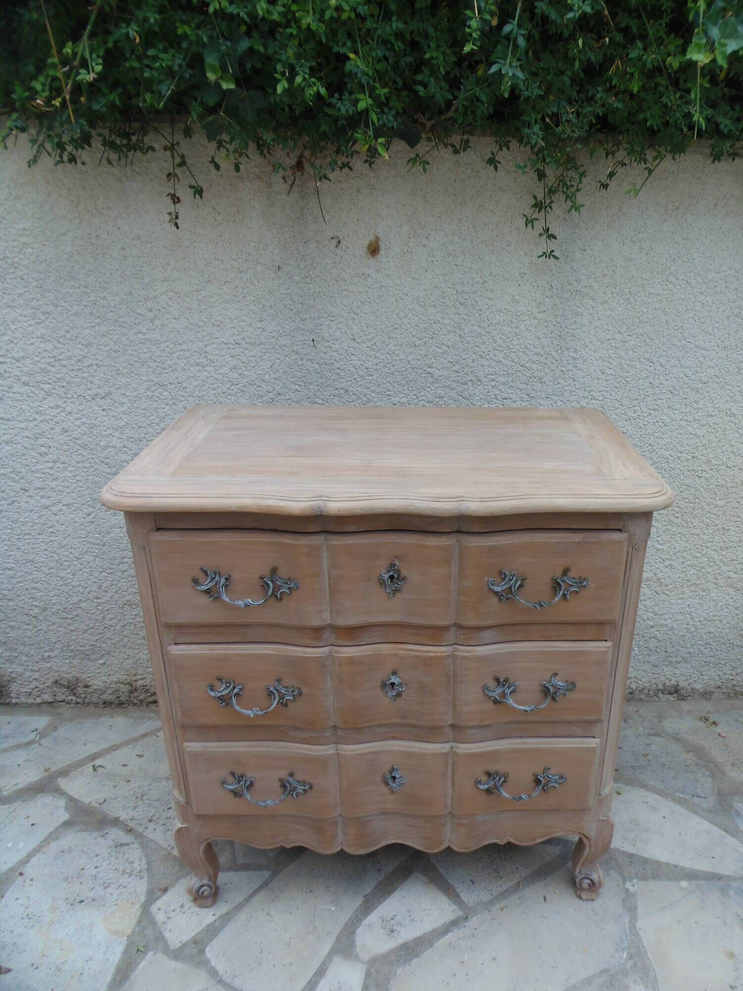 Beautifully crafted Louis XVI style commode in bleached wood.