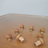 Rare coffee table 110 x 110 x height 35 cm with 8 flange wooden / cork caps in the glass top.