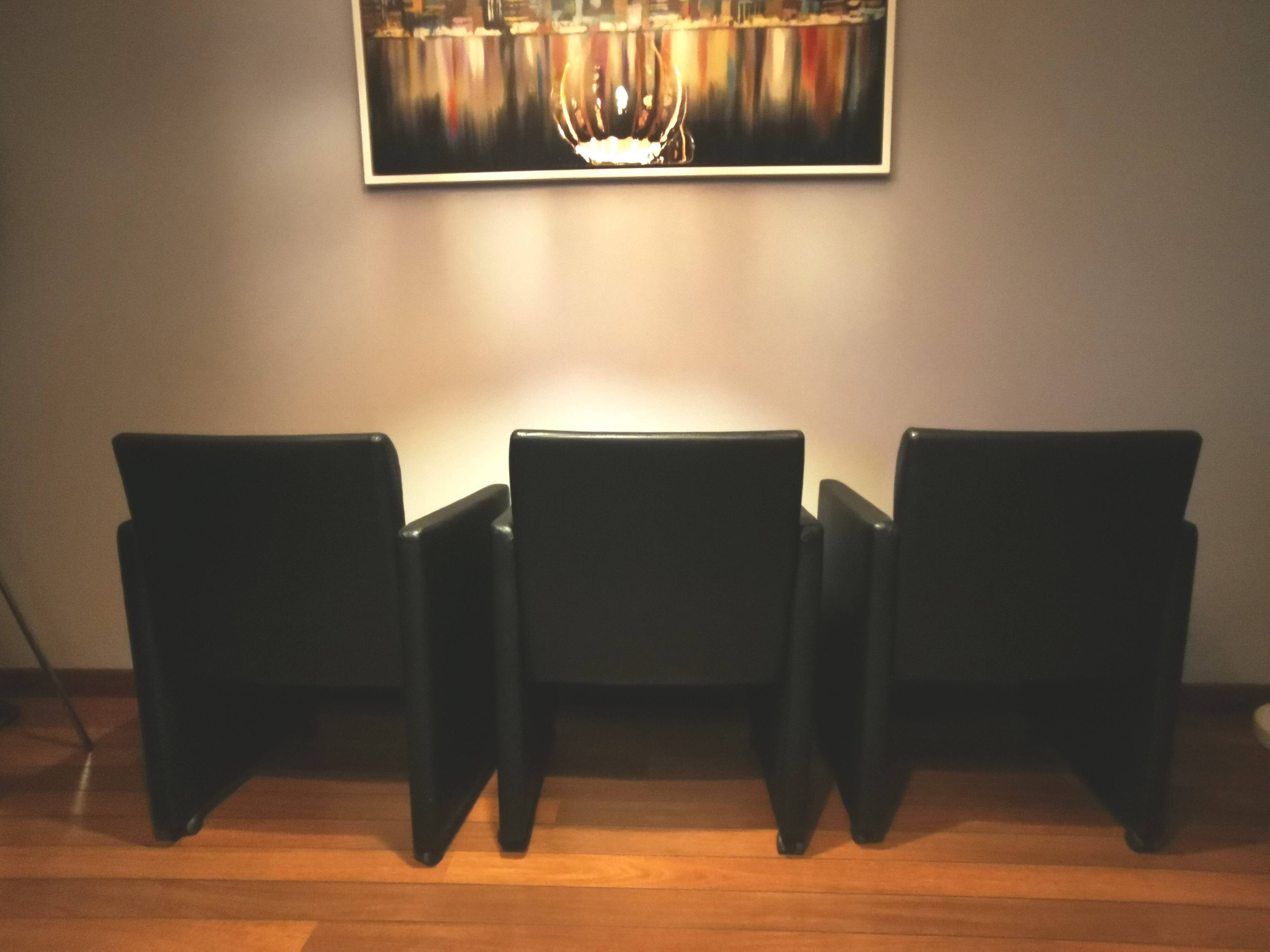 6 faux leather chairs on wheels