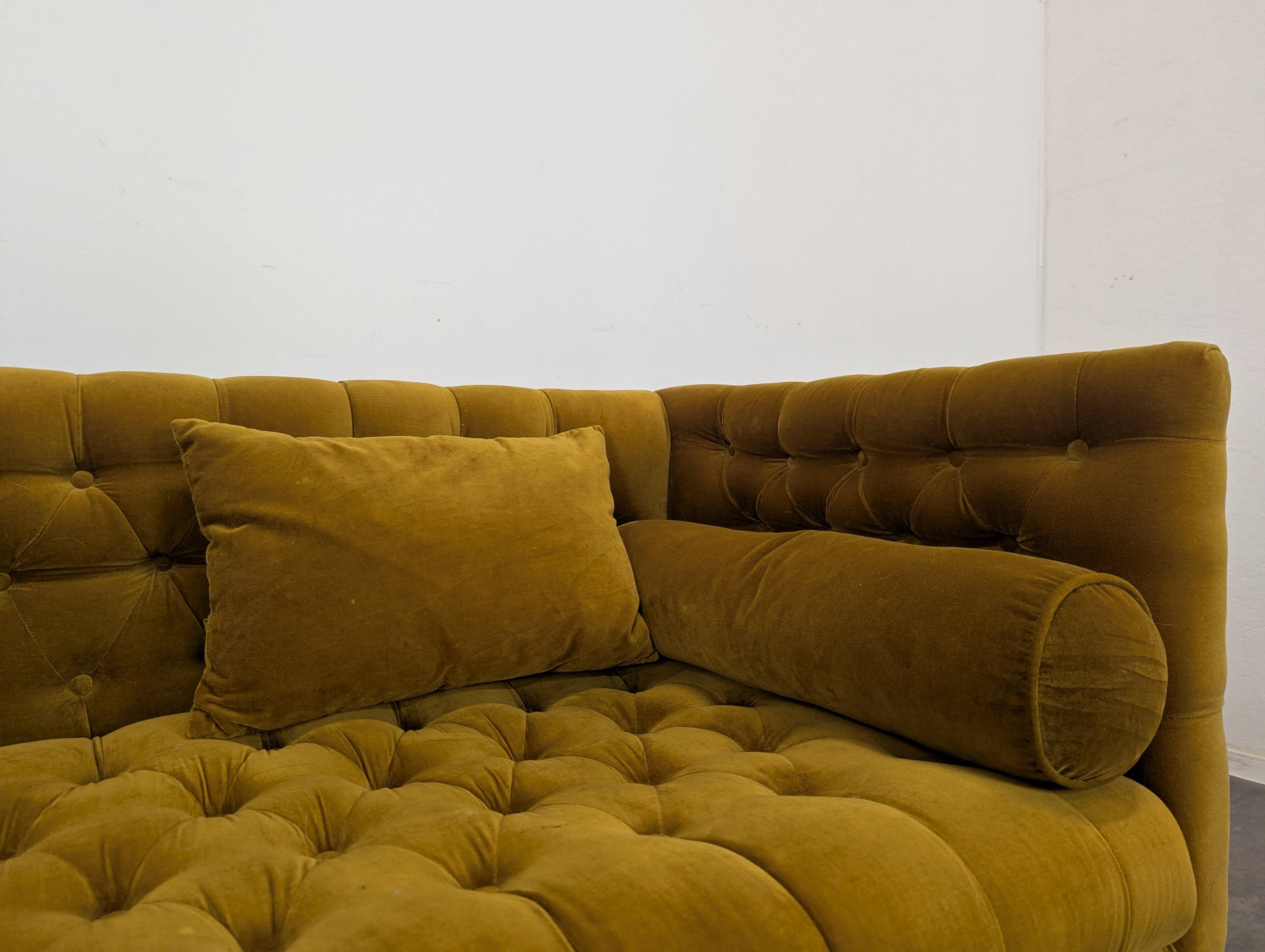 Saffron-colored velvet sofa