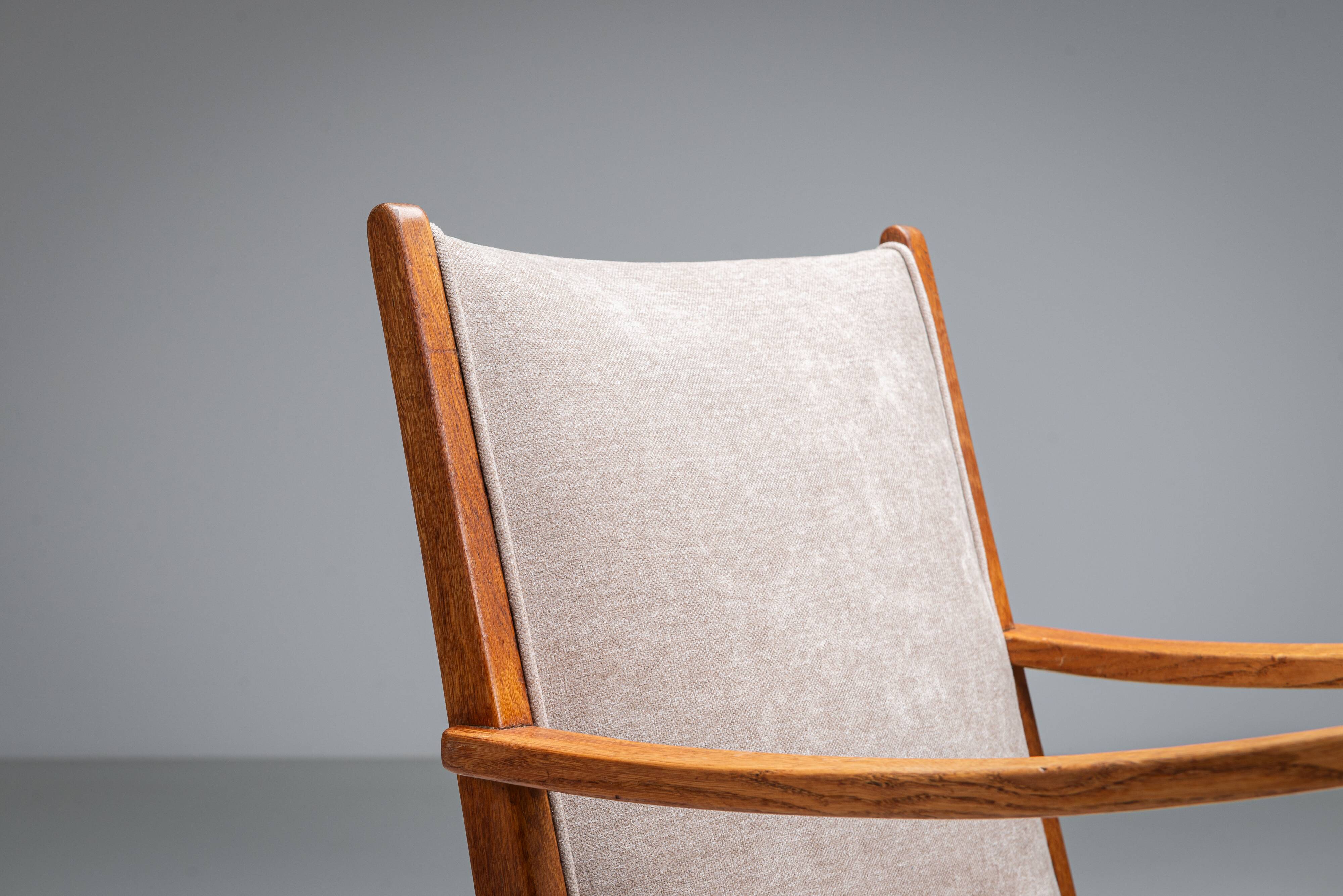 Oak armchair with curved armrests