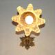 Simple wall sconce in French Art Nouveau bronze with a white glass shade featuring patterns.