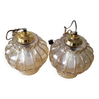 Two Globe chandeliers in molded glass in a beautiful amber color