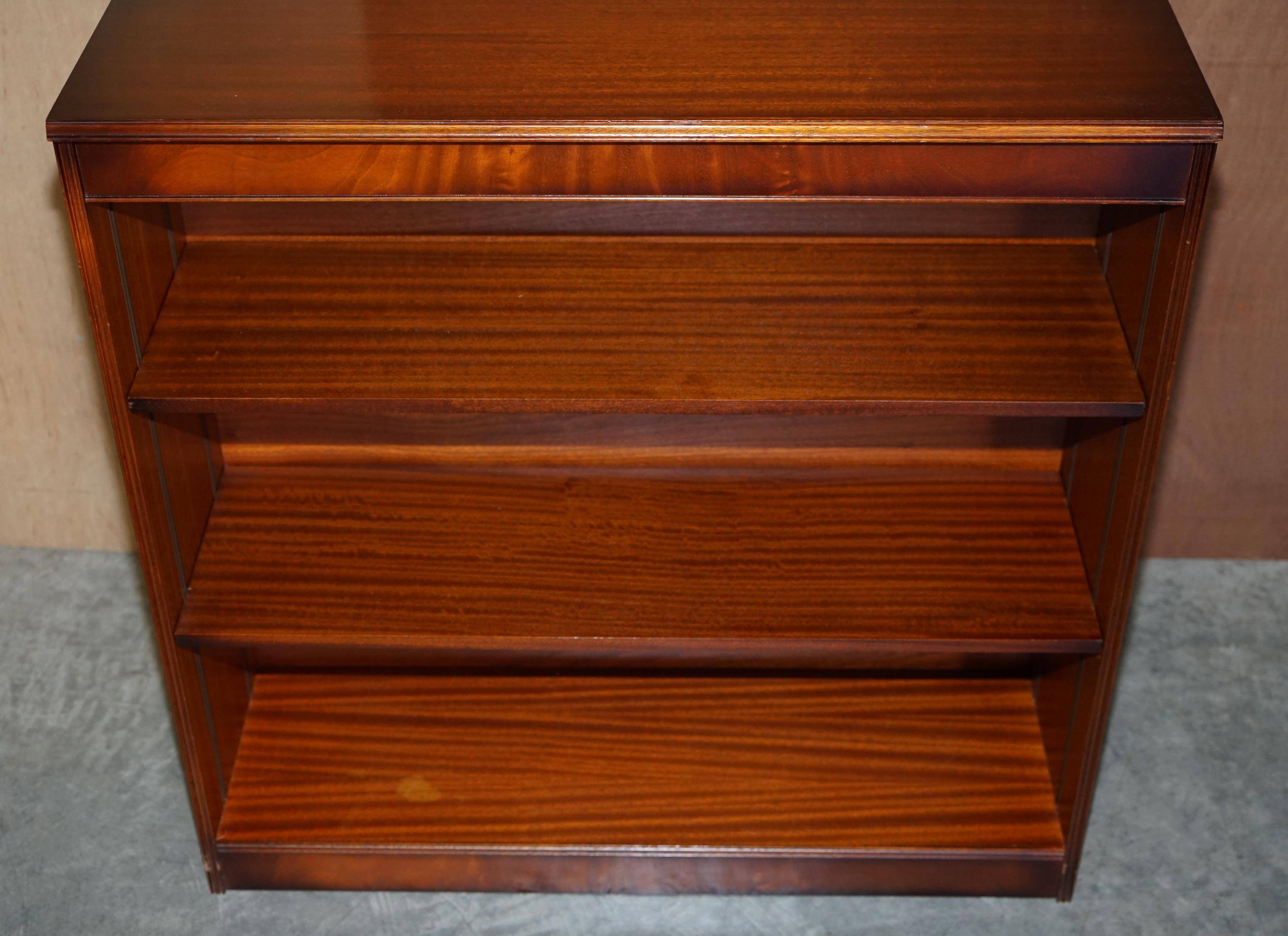 Pair of open dwarf bookshelves in mahogany by Shaws of London.