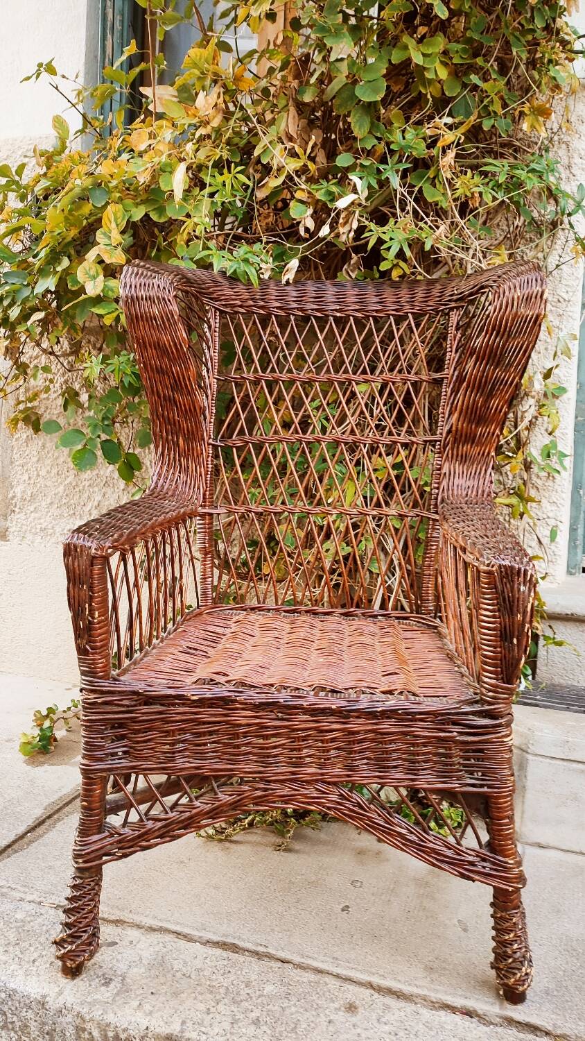 Duo of rattan wing chairs