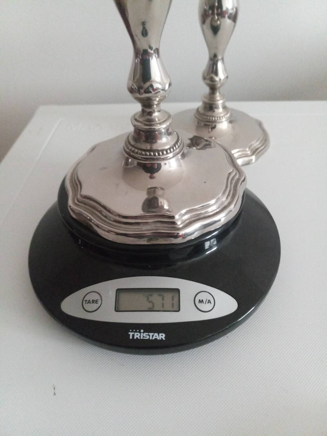 Pair of silver-plated metal candlesticks