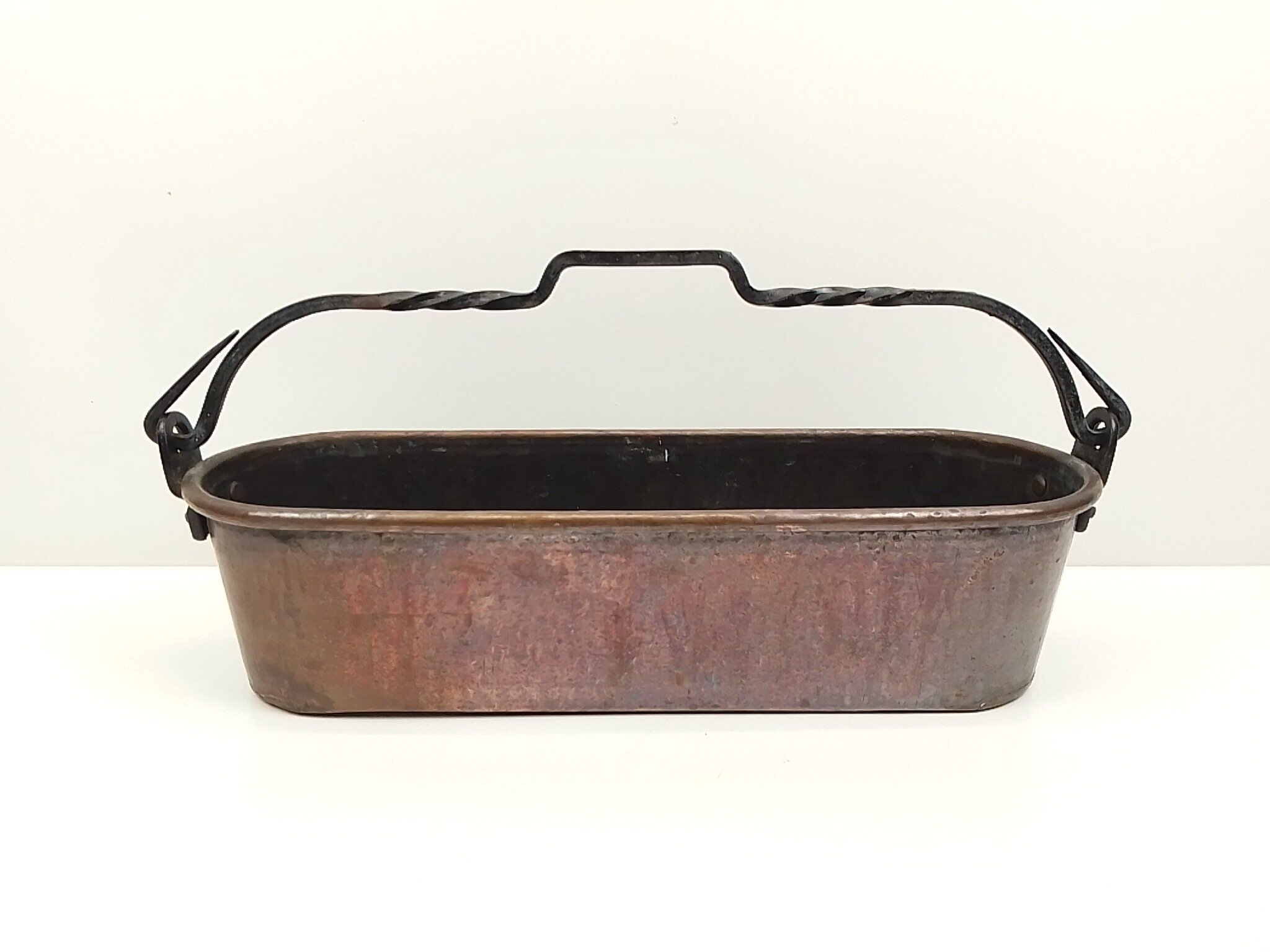 Copper planter and wrought iron handle