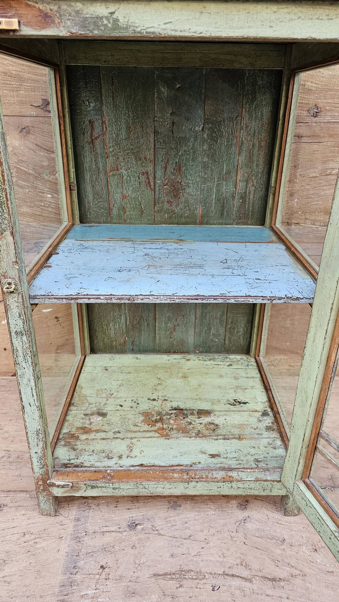 Art Deco glass-fronted bar cabinet in teak