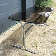 Dining table of the 70s in smoked glass and chromed metal