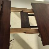 English dining room table in mahogany veneer late nineteenth with two extensions (from 1m80 to 2m80)