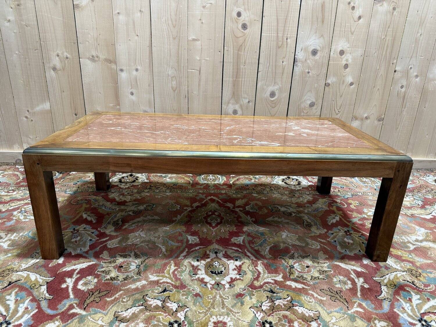 Contemporary coffee table in mahogany and marble.