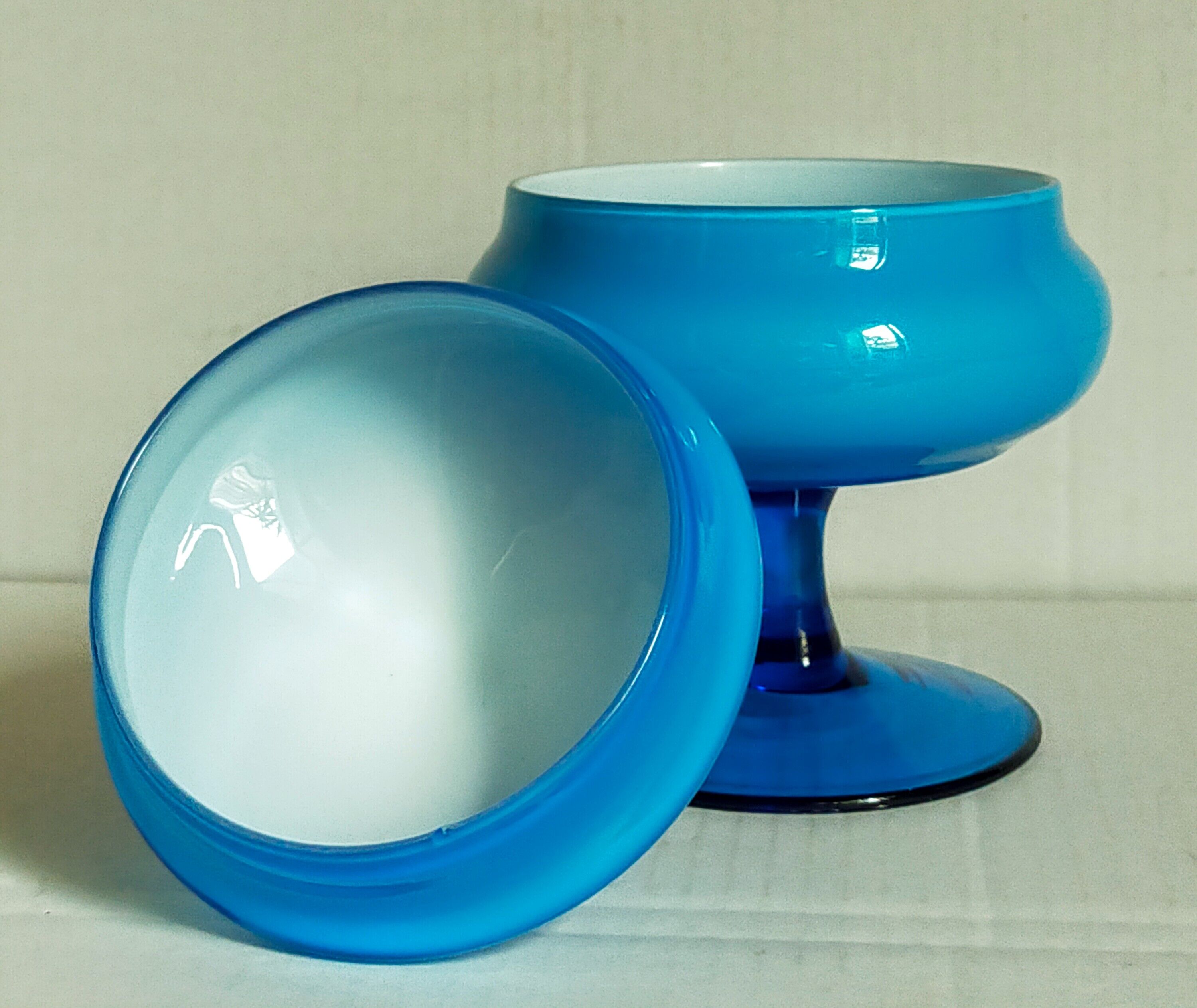 Covered pot on foot in vintage blue opaline