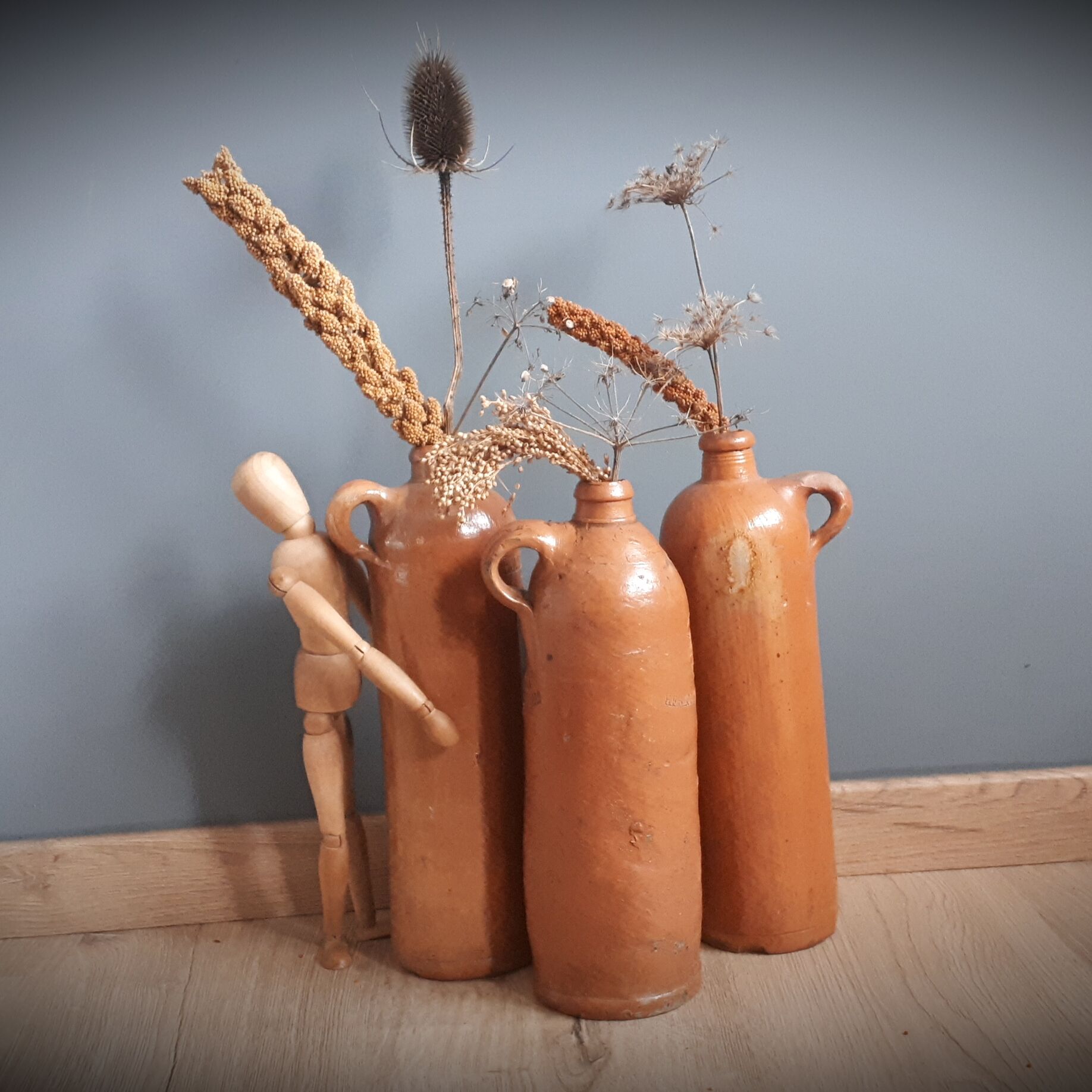 Trio of sandstone bottles