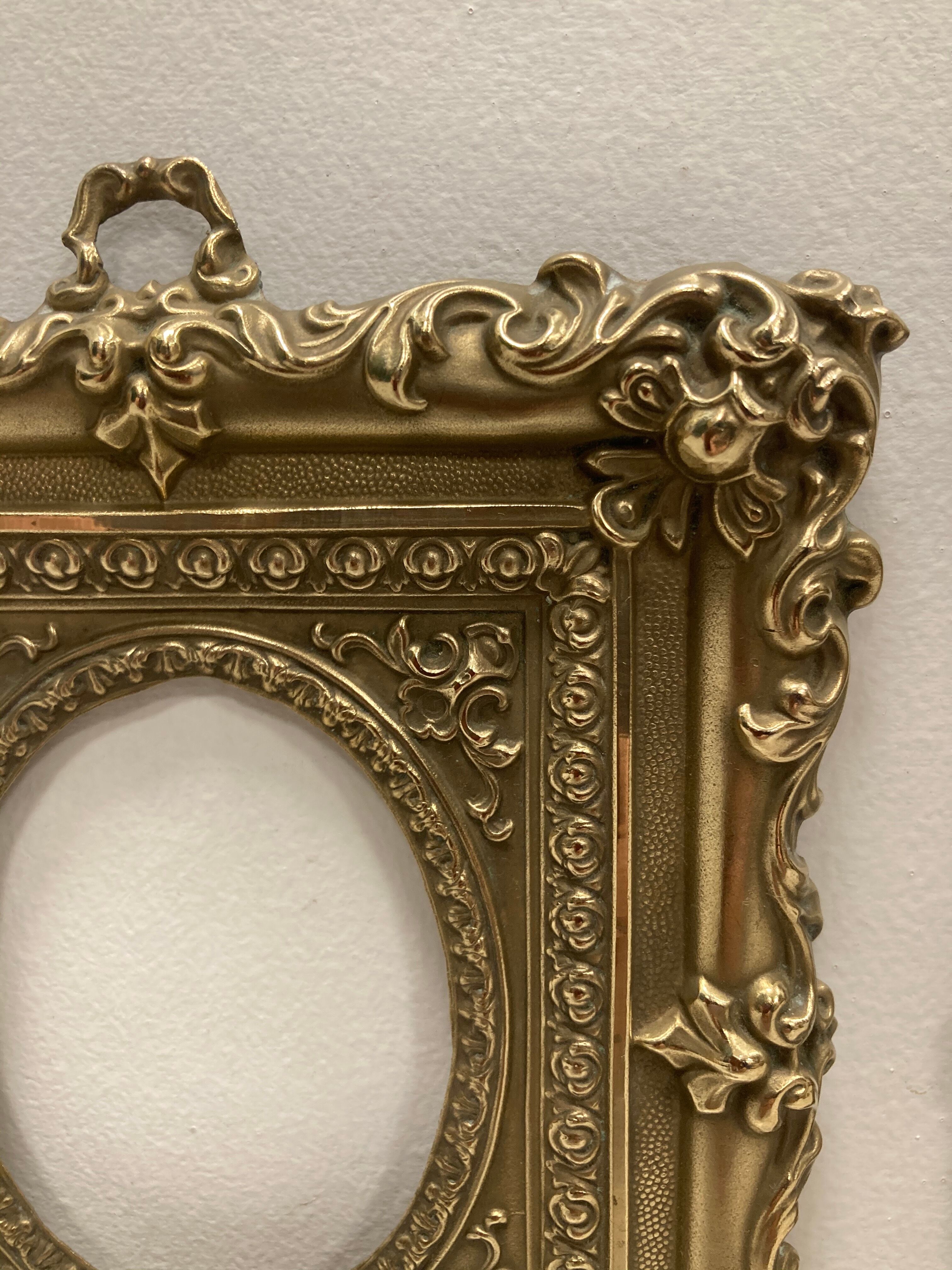 Pair of brass photo frames