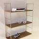 Golden wire shelf in metal with a wood effect.