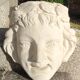 Old face in plaster antique decoration