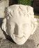 Old face in plaster antique decoration