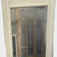Louis XVI style mirror in wood and patinated stucco 20th century