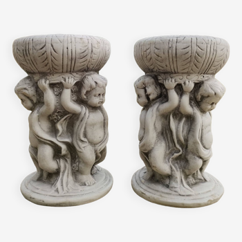 Pair of garden candlesticks with cherubs - old stone patinated resin - France - Early 2000