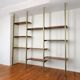 Tension pole free standing rose gold aluminum Omni wall unit by George Nelson