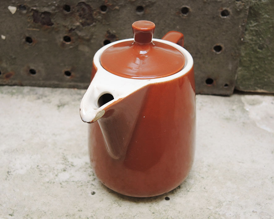 Old brown ceramic coffee maker