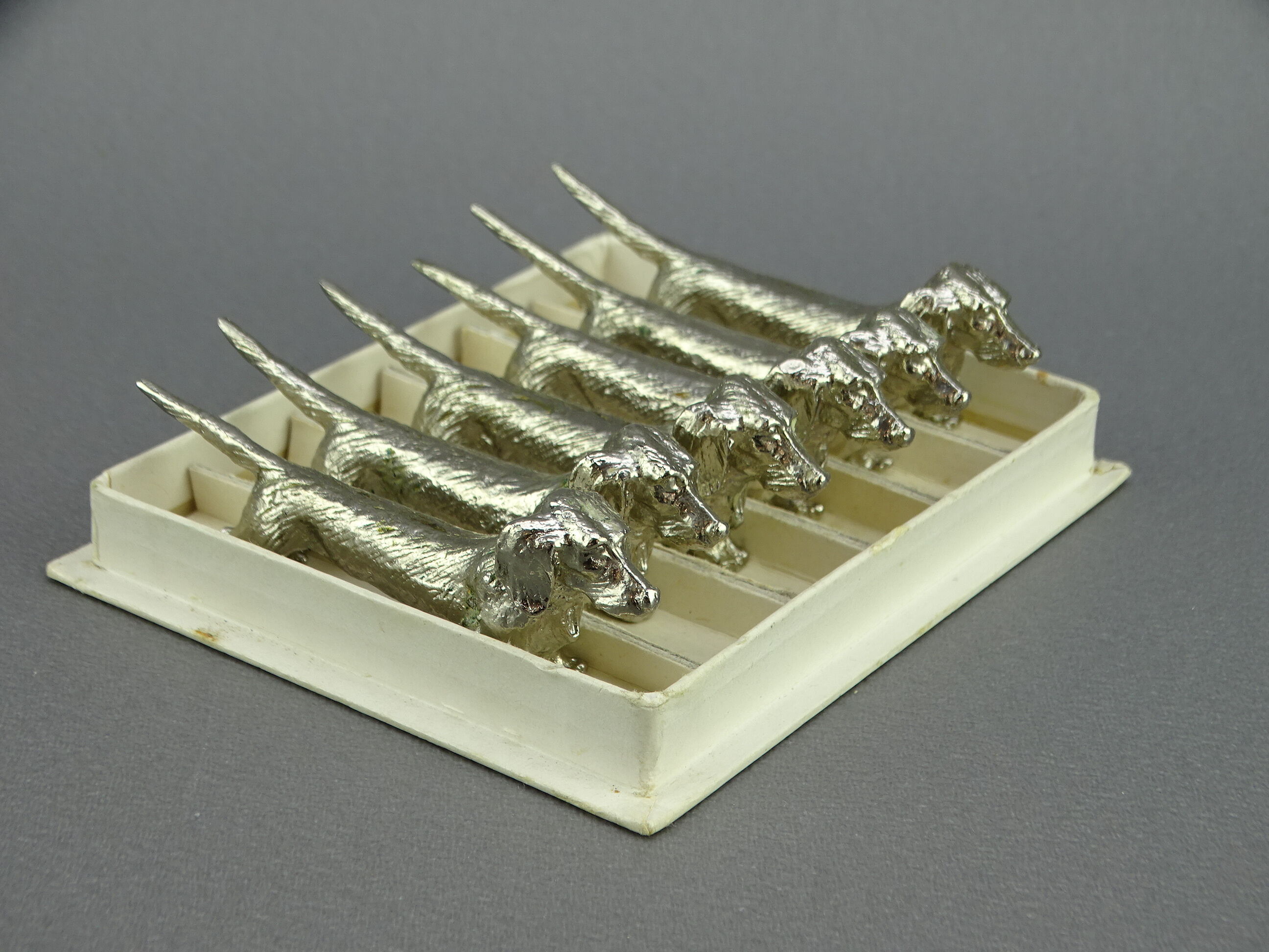 Set of 6 silver metal knife holders with basset dachshund dogs
