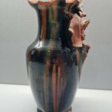 Terracotta vase with a child's head