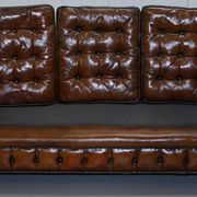 Restored vintage leather Chesterfield canapé in Thomas Chippendale style.