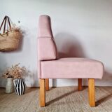 Single bar stool in pink stitched faux leather.