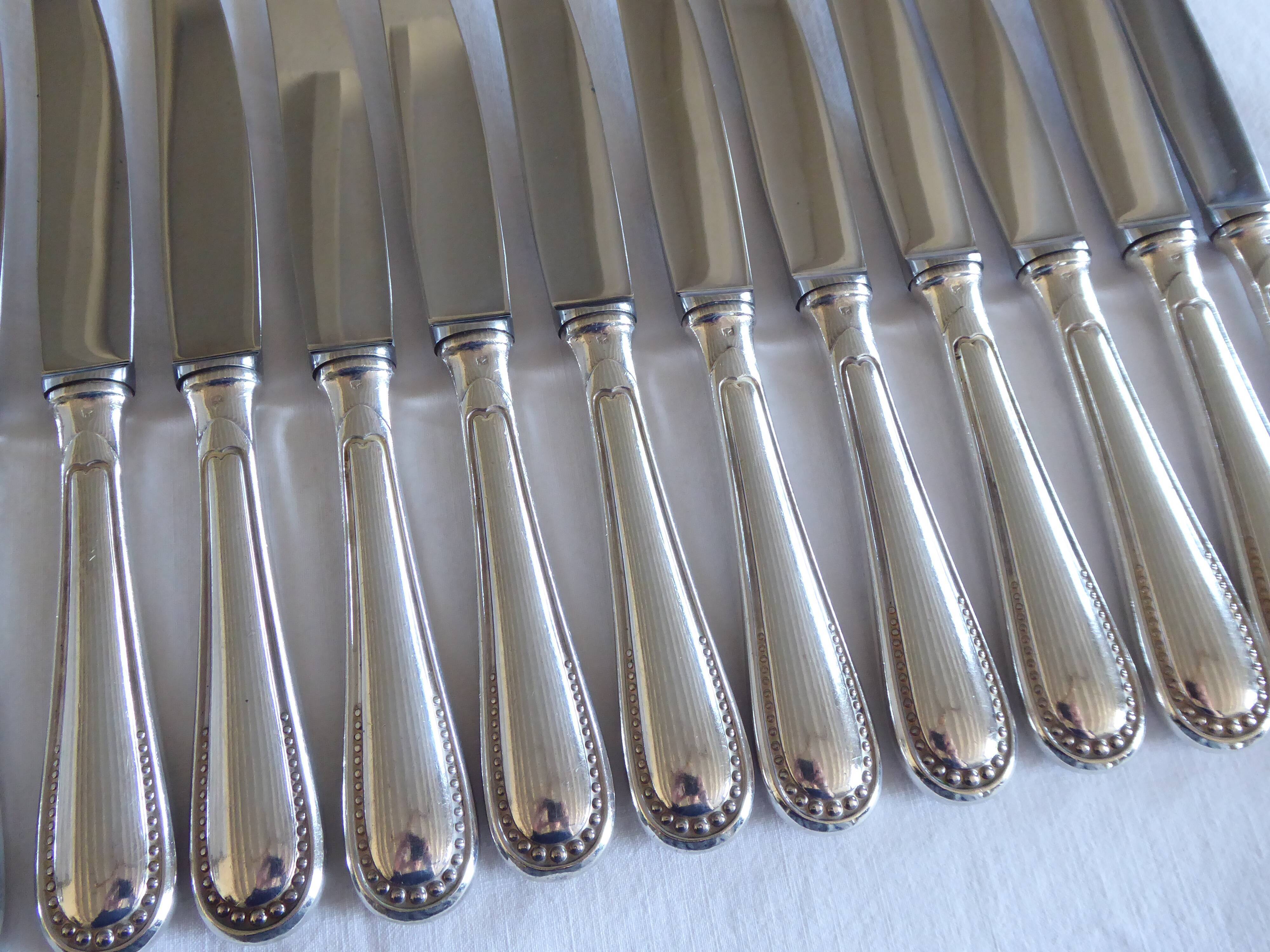 12 couteaux de table métal argenté