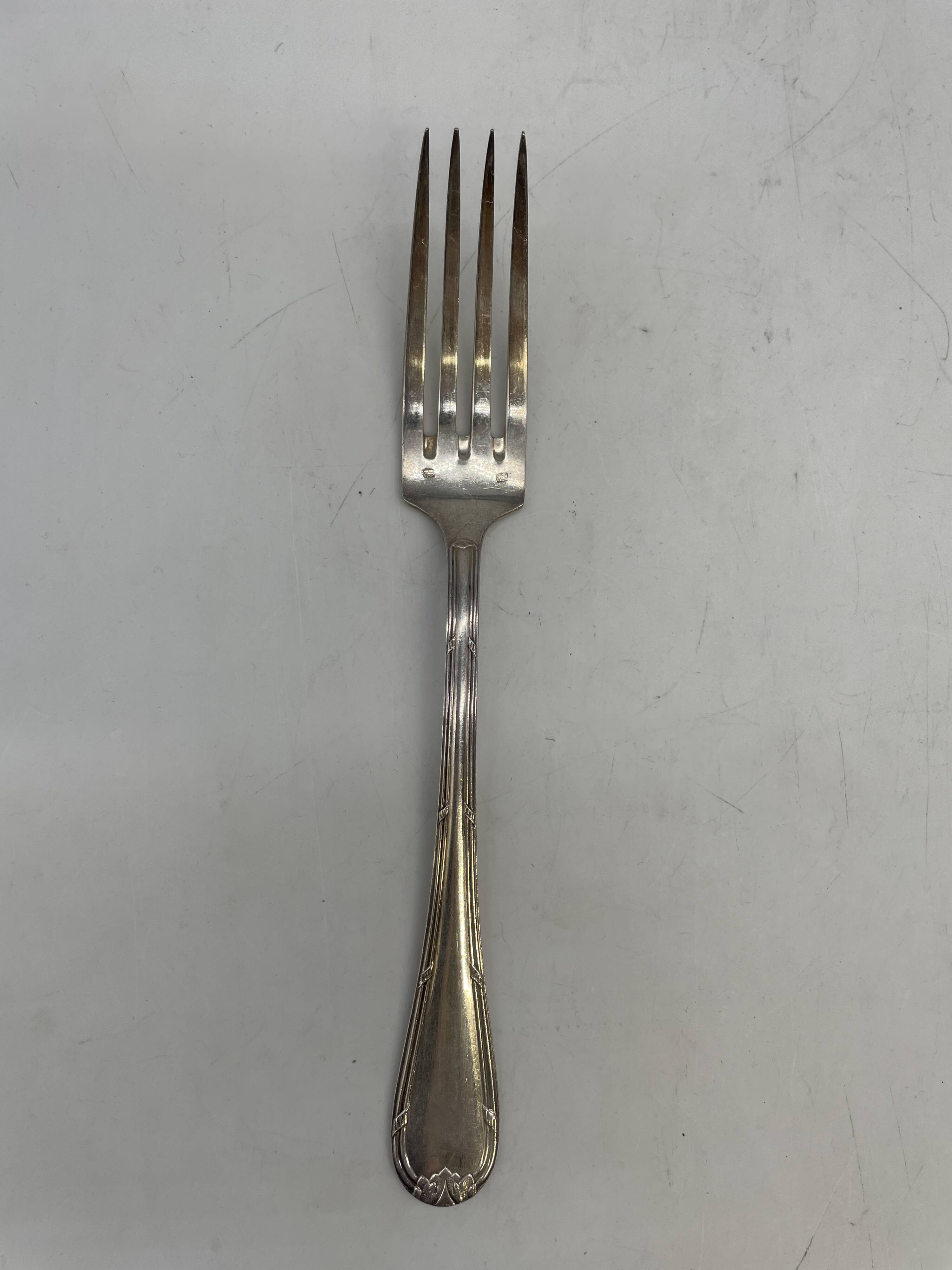 Set of 12 soup spoons and 6 silver-plated lunch forks.