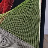 Large psychedelic design painting with multicolored stitch and thread from the 1970s